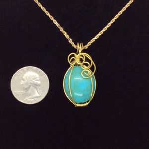 Turquoise and gold wire wrapped pendant